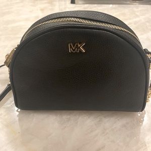 New without tags Michael Kors half moon crossbody.